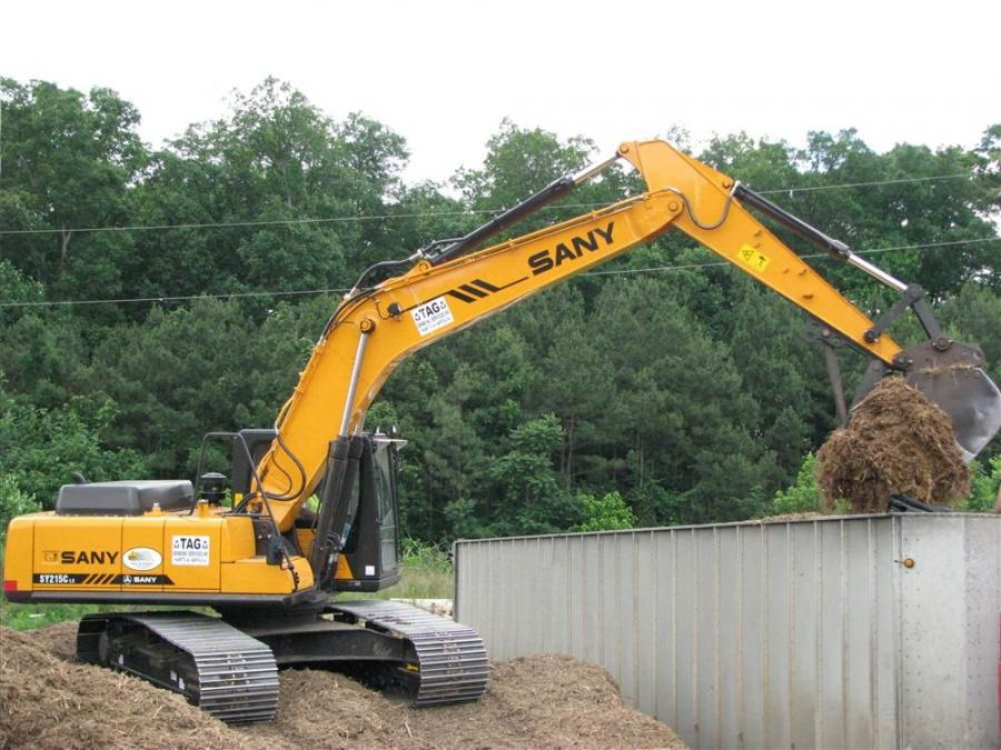 The operator of Tag Grinding’s new SANY SY215C excavator loads mulch at the Marietta, Ga., grinding operation.