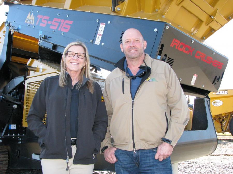 Marla Spooner Neise and Chuck Spooner standing with new IROCK machine